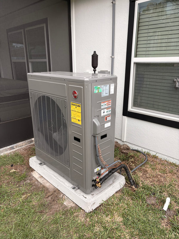 Outdoor heating and cooling equipment photographed during a Tropicool project